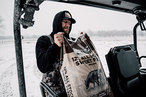 Chase Rice with livestock feed
